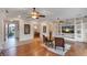 Spacious living room with hardwood floors, ceiling fans, and custom built-ins at 3540 Wisdom Ct, Las Vegas, NV 89120