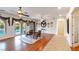 Open-concept living room with hardwood floors, stylish decor and backyard pool view at 3540 Wisdom Ct, Las Vegas, NV 89120