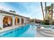 Inviting pool with spa, shaded outdoor seating, and tiki bar creates a perfect oasis for relaxation and enjoyment at 3540 Wisdom Ct, Las Vegas, NV 89120