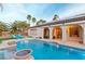 Relaxing pool area features a spa, solar panels, and covered patio, creating an ideal space for outdoor living at 3540 Wisdom Ct, Las Vegas, NV 89120