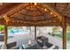 Tiki bar with hanging lights offers a resort style atmosphere for outdoor entertaining near the pool and patio at 3540 Wisdom Ct, Las Vegas, NV 89120