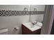 Bathroom features a modern vanity with a decorative tile border, providing a functional and stylish space at 3717 Casey Dr, Las Vegas, NV 89120