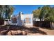 Quaint single-story home with a white brick chimney, charming blue shutters, and a cozy, inviting appeal at 3717 Casey Dr, Las Vegas, NV 89120
