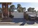 Well-maintained two car garage featuring a clean driveway and mature landscaping enhancing curb appeal at 3717 Casey Dr, Las Vegas, NV 89120