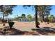 Fenced community pool with clear blue water and lounge chairs offers residents a refreshing escape on sunny days at 3717 Casey Dr, Las Vegas, NV 89120