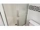 The bathroom features a shower with a grab bar and geometric tile border for added style at 3717 Casey Dr, Las Vegas, NV 89120