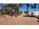 Spacious community yard with mature trees, manicured bushes, and ample space for outdoor activities and relaxation at 3717 Casey Dr, Las Vegas, NV 89120