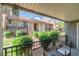 Balcony view of a multi-story home with green landscaping and lawn at 4390 Sandy River Dr # 1, Las Vegas, NV 89103