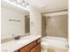 Well lit bathroom with a granite topped vanity and shower/tub combo at 4390 Sandy River Dr # 1, Las Vegas, NV 89103