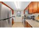 Modern kitchen with stainless steel refrigerator, electric range, dishwasher, and ample counter space at 4390 Sandy River Dr # 1, Las Vegas, NV 89103