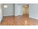 Spacious living room with wood flooring, neutral walls, and a bright interior, freshly painted at 4390 Sandy River Dr # 1, Las Vegas, NV 89103