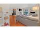 Bright living room with wood floors, sliding glass doors to a patio, view of the kitchen, and modern furnishings at 4390 Sandy River Dr # 1, Las Vegas, NV 89103