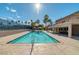 The large swimming pool features well-maintained landscaping, seating, and clear skies at 4390 Sandy River Dr # 1, Las Vegas, NV 89103