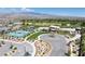 Aerial image showcasing community amenities like tennis courts and clubhouse, set against a mountain backdrop at 4531 S Bay Tree Ct, Pahrump, NV 89061