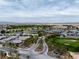 Scenic aerial view showcasing the community's golf course, landscaping, and beautiful desert surroundings at 4531 S Bay Tree Ct, Pahrump, NV 89061