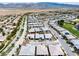 Stunning aerial view of a Primary-planned community with lush landscaping, golf course, and mountain views at 4531 S Bay Tree Ct, Pahrump, NV 89061