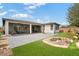 Lush backyard with an extended patio, water feature and beautifully manicured lawn, creating an oasis at 4531 S Bay Tree Ct, Pahrump, NV 89061