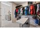 Spacious closet with ample hanging storage and shelving adjacent to the laundry area at 4531 S Bay Tree Ct, Pahrump, NV 89061