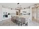 Modern kitchen with white cabinets, tile backsplash, and large center island at 4531 S Bay Tree Ct, Pahrump, NV 89061