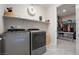 The laundry room has modern washer and dryer and connects to the closet at 4531 S Bay Tree Ct, Pahrump, NV 89061
