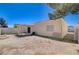 View of the backyard with a covered patio and privacy fence at 4716 Cohiba Way, North Las Vegas, NV 89031