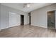 Primary bedroom boasts wood-look flooring, large closet, and an ensuite bathroom for convenience at 4716 Cohiba Way, North Las Vegas, NV 89031
