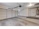A two car garage featuring white door, opener and water heater at 4716 Cohiba Way, North Las Vegas, NV 89031