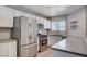 Bright kitchen with stainless steel appliances, sleek countertops, and modern white cabinetry at 4716 Cohiba Way, North Las Vegas, NV 89031