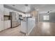 Modern kitchen featuring stainless steel appliances, bar seating, and bright, natural light at 4716 Cohiba Way, North Las Vegas, NV 89031