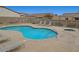 Inviting community pool with clear blue water and surrounding lounge chairs at 4716 Cohiba Way, North Las Vegas, NV 89031