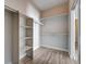 Walk-in closet with built-in shelving and hanging rods provides ample storage solutions at 4716 Cohiba Way, North Las Vegas, NV 89031
