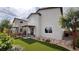 Private backyard with a covered patio, synthetic grass, and low maintenance desert landscaping at 5151 Capucina St # Lot 1, Las Vegas, NV 89122