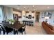 Open concept kitchen with stainless steel appliances, modern white cabinets, and large island with seating at 5151 Capucina St # Lot 1, Las Vegas, NV 89122