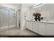 Sleek bathroom with double vanity, modern fixtures, and a glass-enclosed shower for a spa-like experience at 5151 Capucina St # Lot 1, Las Vegas, NV 89122