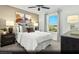 Comfortable bedroom with stylish decor, featuring a large window with scenic views and ample natural light at 5151 Capucina St # Lot 1, Las Vegas, NV 89122