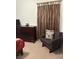 Bedroom with dresser, chair, and soft carpeting at 5158 S Jones Blvd # 105, Las Vegas, NV 89118