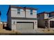 Charming two-story home boasts a neutral color palette and a convenient two-car garage for modern living at 5169 Capucina St # Lot 4, Las Vegas, NV 89122