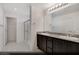 Elegant main bathroom features dual sinks, dark wood cabinetry, granite counters and a glass-enclosed shower at 5169 Capucina St # Lot 4, Las Vegas, NV 89122