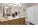 Bathroom with a double sink vanity, and large mirror at 5235 Caspian Springs St # 101, Las Vegas, NV 89120