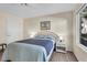 Charming bedroom featuring a comfortable bed, side table, and natural light at 5235 Caspian Springs St # 101, Las Vegas, NV 89120