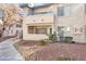 Two story condo building featuring exterior stairs and a charming, well maintained facade at 5235 Caspian Springs St # 101, Las Vegas, NV 89120