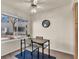 Bright dining area with wood floors, natural light, and modern ceiling fan at 5235 Caspian Springs St # 101, Las Vegas, NV 89120