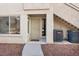 Inviting condo entrance featuring unit number, secure screen door, and well-maintained landscaping at 5235 Caspian Springs St # 101, Las Vegas, NV 89120
