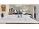 Open kitchen overlooking a living space with a sliding glass door to the outside at 5235 Caspian Springs St # 101, Las Vegas, NV 89120