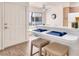 Kitchen featuring breakfast bar seating and hardwood floors at 5235 Caspian Springs St # 101, Las Vegas, NV 89120