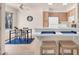 Bright kitchen with breakfast bar, stainless steel appliances, and adjacent dining area at 5235 Caspian Springs St # 101, Las Vegas, NV 89120