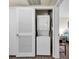 Convenient laundry room featuring a stacked washer and dryer at 5235 Caspian Springs St # 101, Las Vegas, NV 89120