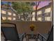 Relaxing patio with comfortable chairs and views of the community at 5235 Caspian Springs St # 101, Las Vegas, NV 89120