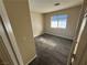 Neutral bedroom with a window for natural light and plush carpeting at 5320 Portavilla Ct # 203, Las Vegas, NV 89122