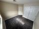 A carpeted bedroom features a closet with sliding doors and a window at 5320 Portavilla Ct # 203, Las Vegas, NV 89122